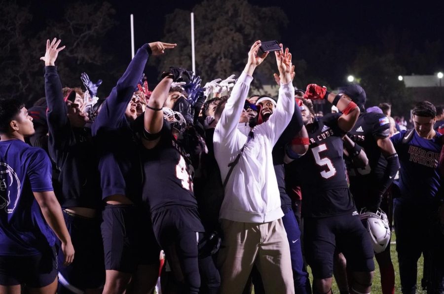 Bear Cubs defensive coordinator Dante DePaola celebrates with a selfie of his defensive unit after Santa Rosa Junior Colleges football team beat the Sierra College Wolverines 24-21 on Nov. 13 at Bailey Field.