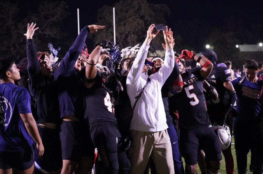 Bear Cubs defensive coordinator Dante DePaola celebrates with a selfie of his defensive unit after Santa Rosa Junior College's football team beat the Sierra College Wolverines 24-21 on Nov. 13 at Bailey Field.