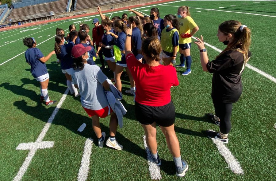 The SRJC women's soccer team huddles together for a cheer at the end of its Thursday practice. Head Coach Crystal Chaidez addressed the team and gave advice to help them prepare for the upcoming playoff match against Diablo Valley College Nov. 5.
