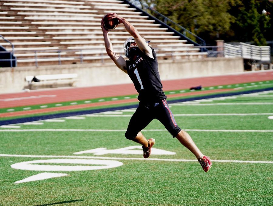 Jorgen Sarganis making a catch during practice on Bailey Field. His death is the third the colleges football team has experienced in the past 17 months.