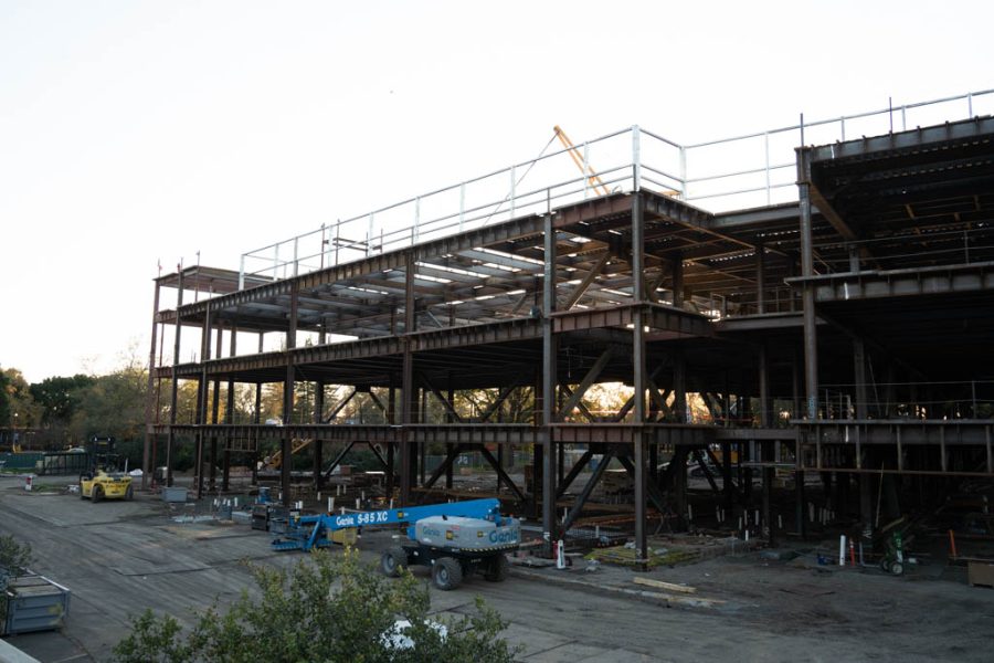 The+frame+of+the+new+SRJC+dorm+building+with+a+white+sky+nearing+sunset+in+the+background.