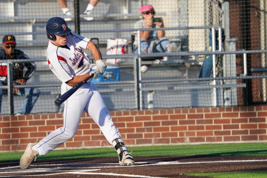 A Santa Rosa Junior College player in mid-swing.