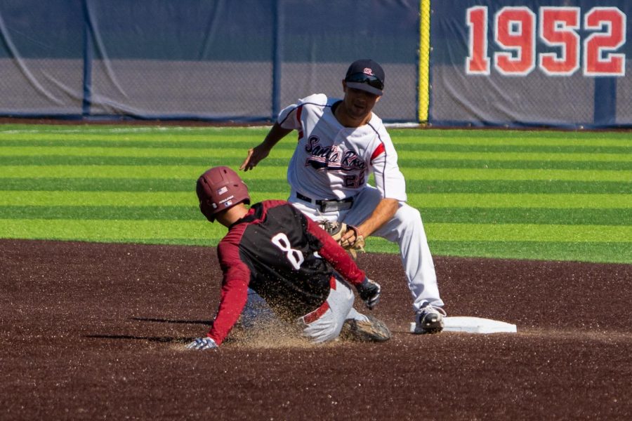 Bear Cubs infielder Davide Migotto tags out Sierra College Wolverines outfielder Kota Suzuki in the top of the 1st inning at Cook Sypher Field in Santa Rosa, Calif., March 8, 2022.