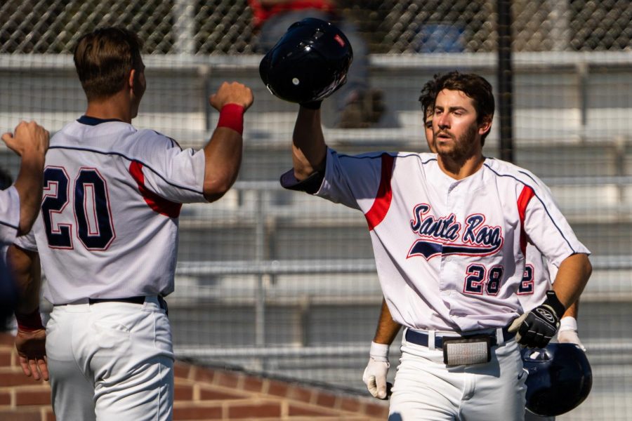 Bear Cubs infielder Noah Rabin celebrates his three-run homerun in the bottom of the 1st against the Sierra College Wolverines at Cook Sypher Field in Santa Rosa, Calif., March 8, 2022.