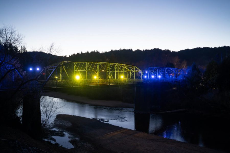 The Guerneville Pedestrian Bridge at dusk with yellow and blue lighting to show support for Ukraine.