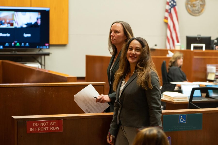 Former SRJC student support manager Hilleary Zarate (front) and her lawyer, Amy Chapman, leave the courtroom after entering a not guilty plea at the Sonoma County Superior Court in Santa Rosa, Calif. on March 28, 2022.