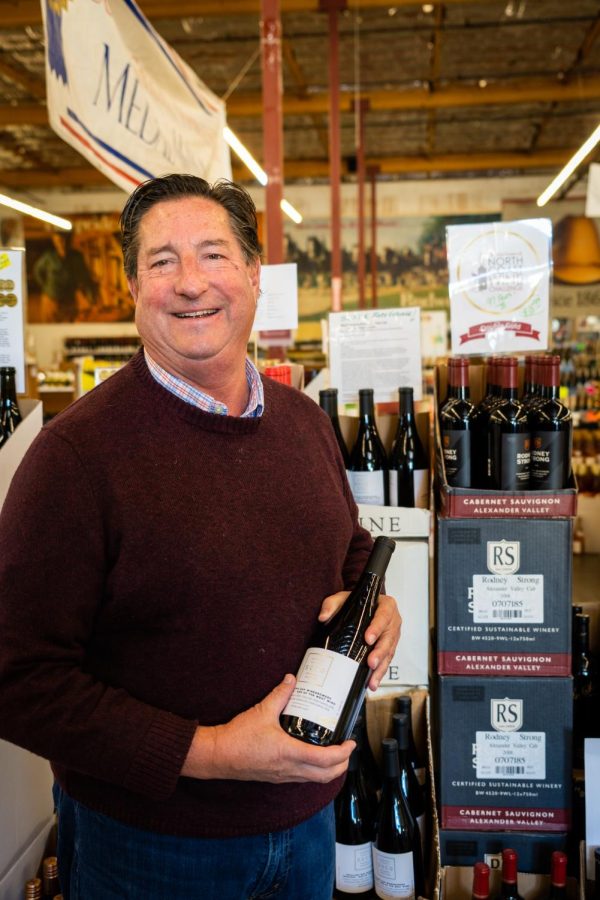 Wine buyer Barry Herbst shows off a Petaluma Gap red blend that has been a hot buy for wine drinkers of all ages at Bottle Barn in Santa Rosa.