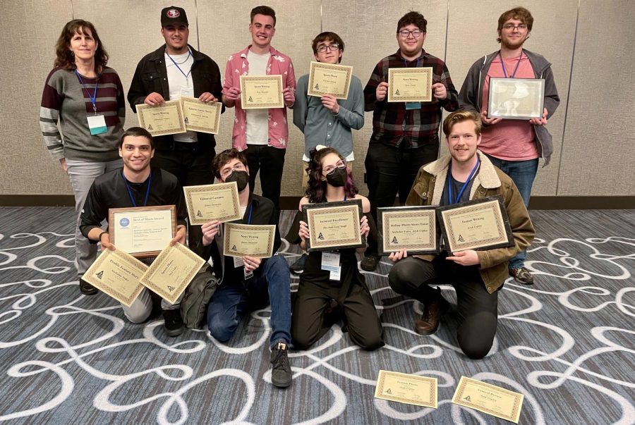 Members of The Oak Leaf staff pose with awards won at the 2022 ACP Spring National College Media Convention on March 5 in Long Beach.