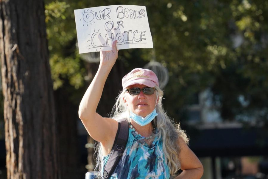 A woman joins dozens of others for an impromptu protest May 3 after a draft of Supreme Court Justice Samual Alitos opinion possibly overturning legalized abortion was leaked to the media.