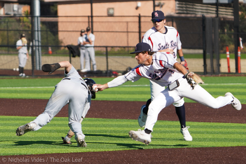 Bear Cubs infielder Max Handron tags out a Marin Mariner during a pickle in the top of the first at Cook Sypher field in Santa Rosa, Calif., on Feb. 15, 2022.