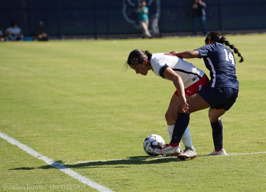 Forward Yasmin Garcia (Blue) fights for the ball against a San Francisco player at Santa Rosa Junior College Tuesday, Aug. 30 2022.