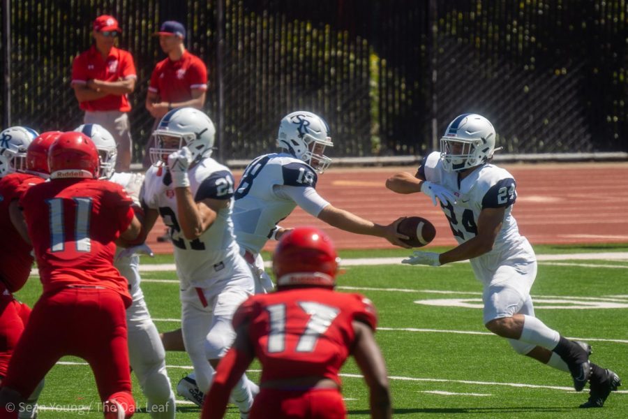 SRJC Bear Cubs quarterback Carson Budke hands a football off to running back Adrian Torres (24) in the 3rd quarter at George M. Rush Stadium in SRJC’s 31-20 loss to City College of San Francisco on Sept. 3.