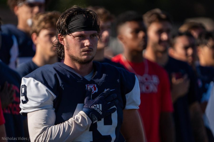 Bear Cubs defensive end Matthew Lojko-Murphy salutes the flag during the national anthem before the game against Chabot College on Sept. 24, 2022 in Santa Rosa.