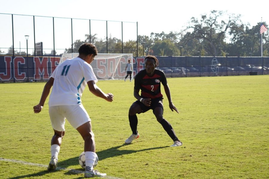 Santa Rosa defender Josh Nakhumwa holds off the Falcons attack in a 1-1 draw Oct. 11. 