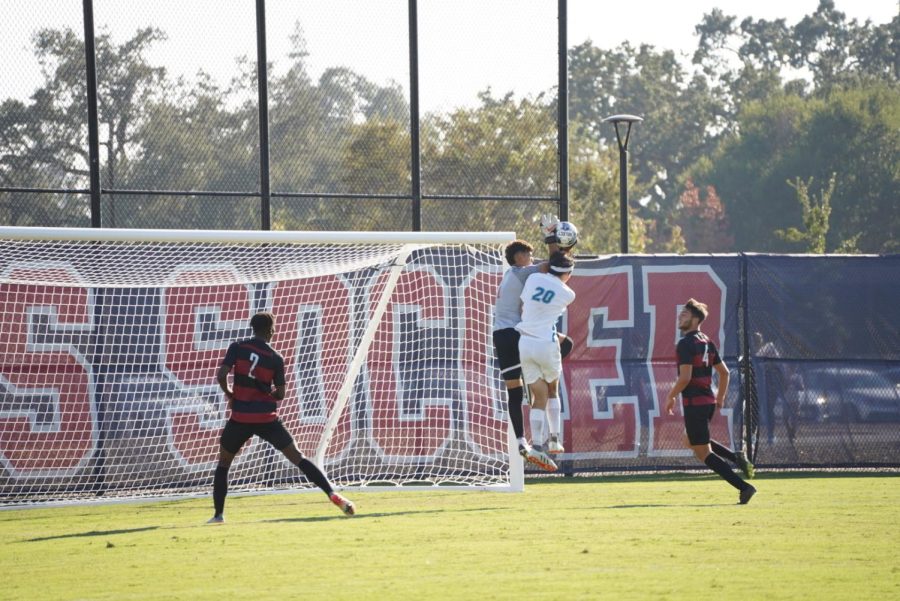 Bear Cubs goalie Emanuel Padilla makes a leaping grab over a Folsom Lake forward in a 1-1 draw Oct. 11.
