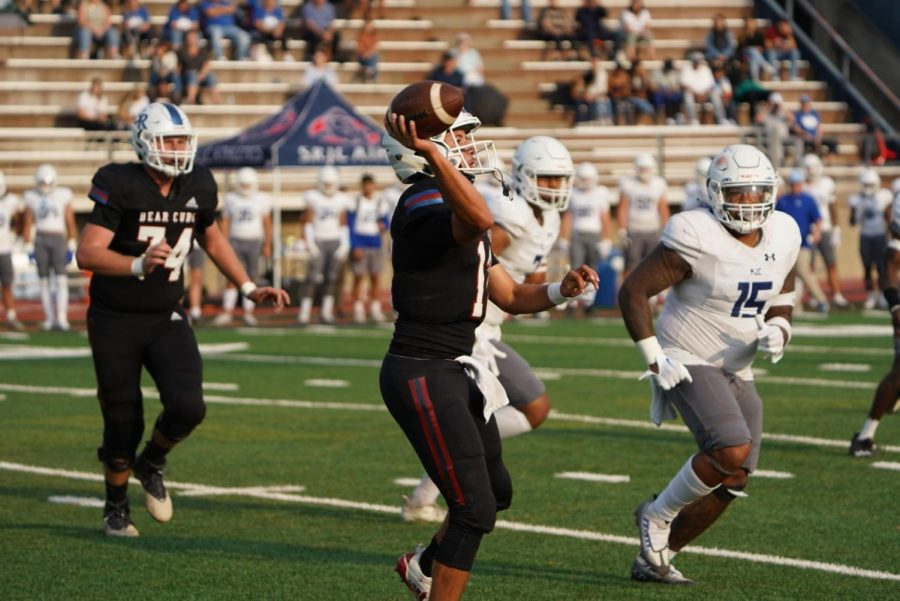 Bear Cubs quarterback Santino Chavez dumps the ball to a running back after evading a sack and fleeing the pocket in a 15-7 loss against the Modesto Pirates Sept. 10 at Bailey Field.