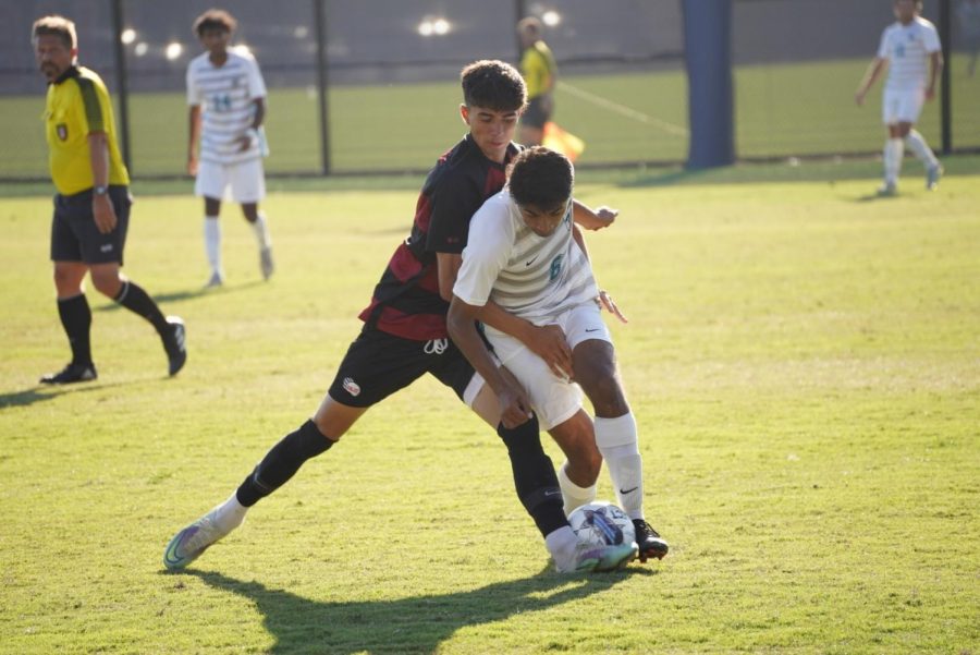 Freshman forward Alex Barragan clashes with a Folsom Lake midfielder.