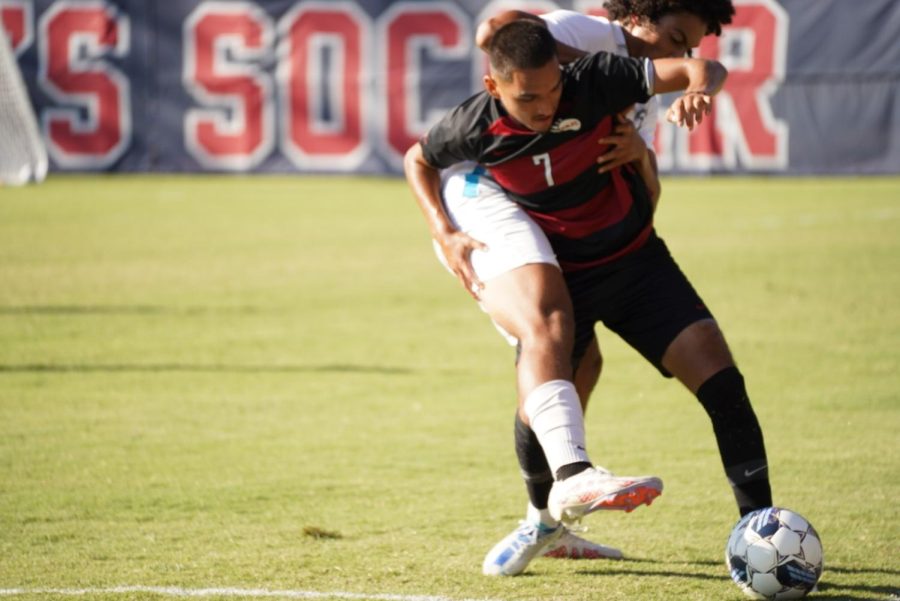 A Folsom Lake player collides with Bear Cubs midfield Alan Sanchez in a 1-1 draw Oct. 11.