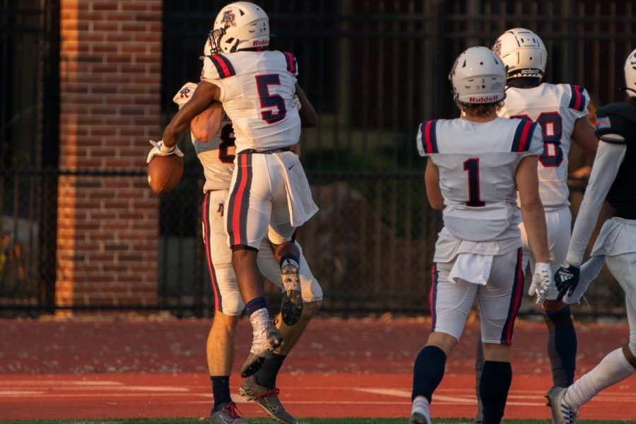 American River College wide receiver Robert Freeman IV, middle, celebrates with his teammates after scoring the first touchdown of the game against Santa Rosa Junior College on Saturday, Oct. 29, 2022 in Santa Rosa.