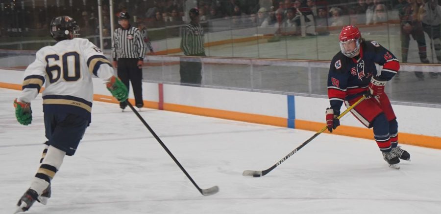 Polar Bears forward Bjorn Hansen skates past UC Davis forward Wyatt Moore to set up one of many scoring chances for SRJC Oct. 14.
