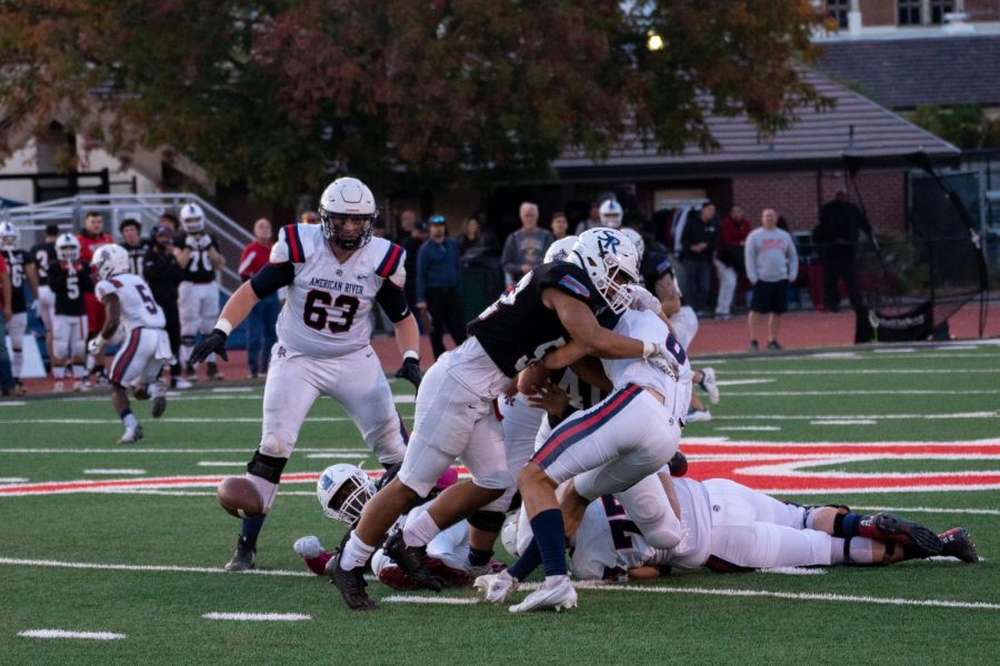 Defensive End Isaac Kim sacks and forces American River quarterback Kenneth Lueth to fumble on Saturday, Oct. 29, 2022 in Santa Rosa.
