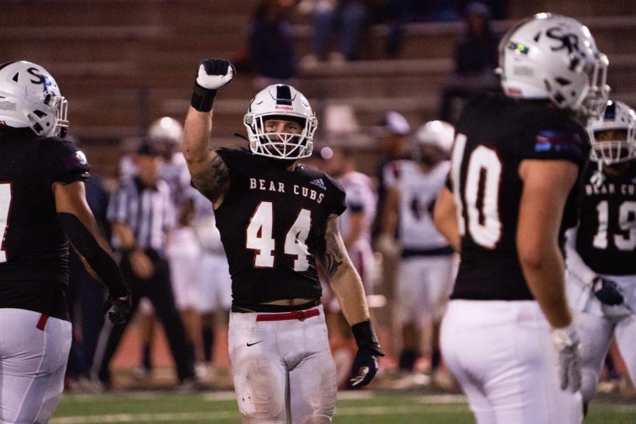 Linebacker Dillon Tingle holds up a closed to indicate a fourth-down after making a drive-ending tackle on Saturday, Oct. 29, 2022 in Santa Rosa.
