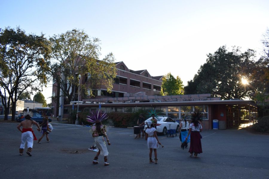 SRJCs Dia de los Muertos procession commences with a dance by Danza Azteca Xantotl outside Barnett Hall.