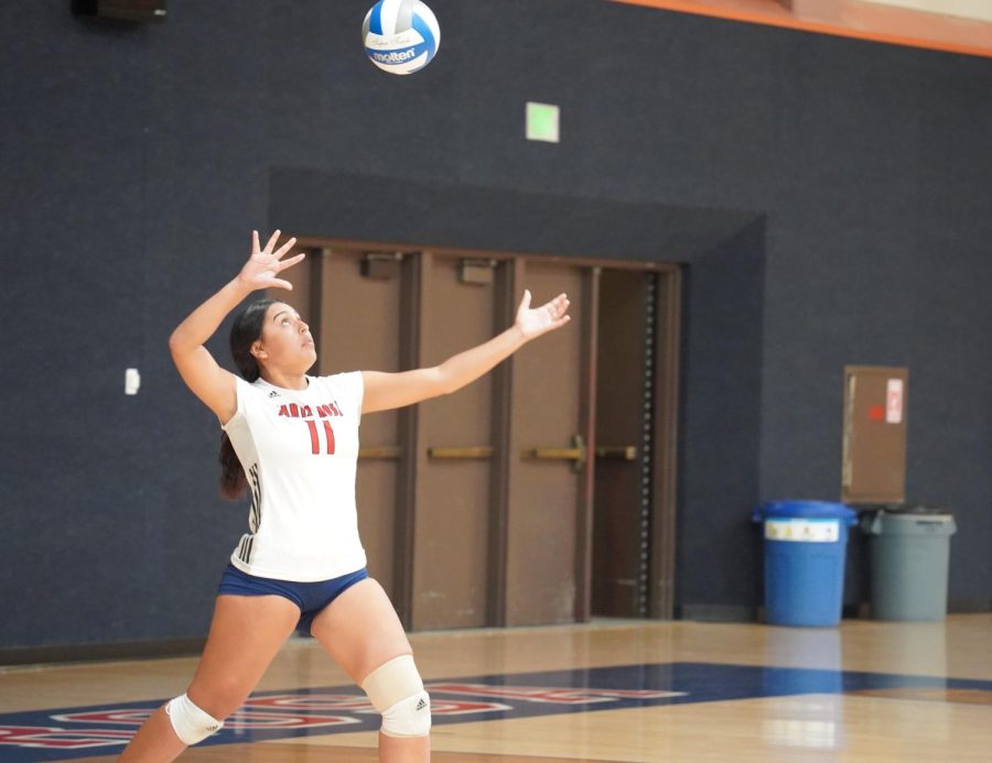 Bear Cubs Setter/Defensive Specialist Yasmin Sierra sets themselves up for a serve in the first set.