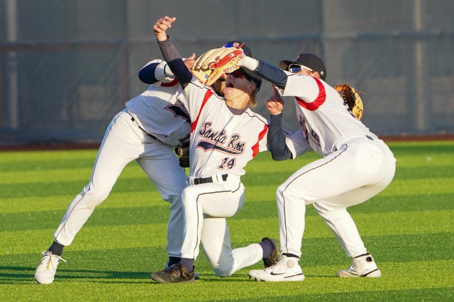The Bear Cubs outfielders pose for a fake selfie in centerfield after beating College of Marin 21-9 on Tuesday, Feb. 21, 2023 in Santa Rosa.