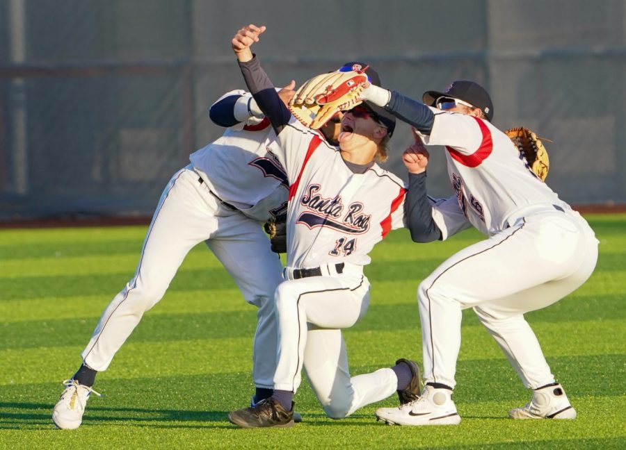 The Bear Cubs outfielders pose for a fake selfie in centerfield after beating College of Marin 21-9 on Tuesday, Feb. 21, 2023 in Santa Rosa.