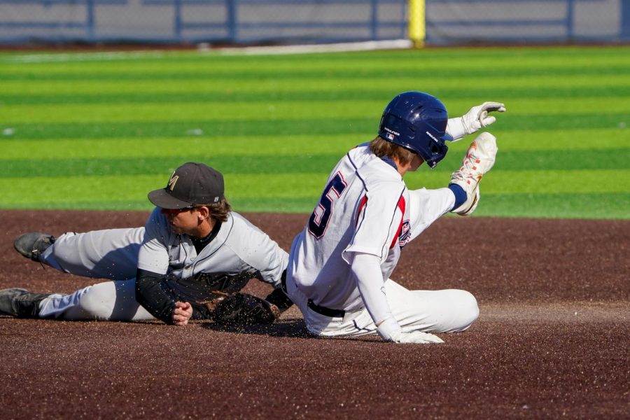 Sophomore Austin Ehrlicher slides safely into second base after the ball was overthrown into centerfield in a 21-9 stomping of the Mariners on Tuesday, Feb. 21, 2023 in Santa Rosa