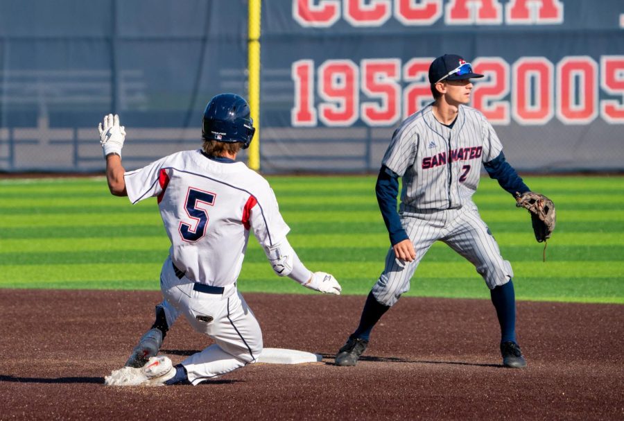 Bear Cubs pitcher Austin Ehrlicher slides into second base, earning himself an RBI double against San Mateo College on Tuesday, Feb. 14, 2023 in Santa Rosa. 
