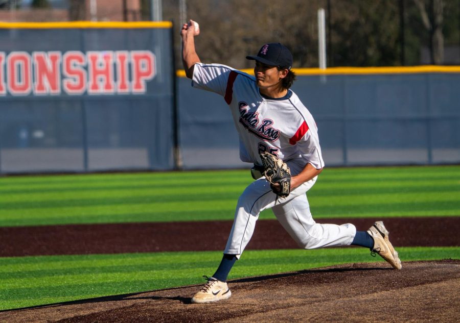 Bear Cubs pitcher Hekili Robello warms up after a near-hour long bottom of the second inning against San Mateo College on Tuesday, Feb. 14, 2023 in Santa Rosa. 