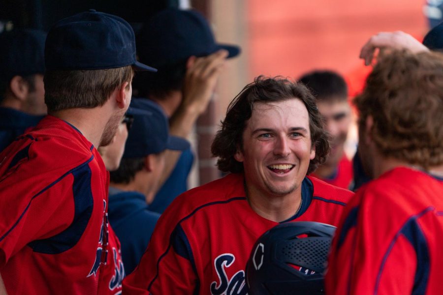 Bear Cubs infielder/pitcher Connor Charpiot is all smiles after hitting an RBI double and getting knocked in home by teammate Austin Ehrlicher against Mission College on Saturday, Feb. 18, 2023 in Santa Rosa.