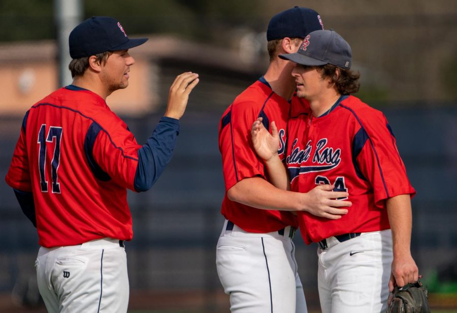 Bear Cubs players Robert Gabbart, left, and Jake McCoy, middle, congratulate Connor Charpiot after pitching 2.2 innings of relief and picking up the save against Mission College on Saturday, Feb. 18, 2023 in Santa Rosa.