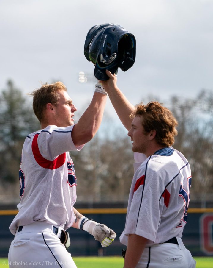 Bear Cubs outfielder/pitcher Jake McCoy, left, celebrates with his teammates after hitting a three-run shot in the bottom of the fifth against College of Marin on Friday, Feb. 10, 2023 in Santa Rosa. 
