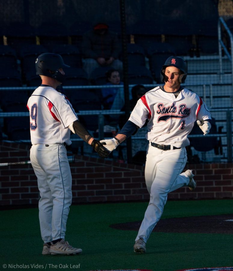 Bear Cubs outfielder/pitcher Alex Leopard, right, runs back to the dugout after scoring a little-league home run against College of Marin on Tuesday, Feb. 21, 2023 in Santa Rosa.