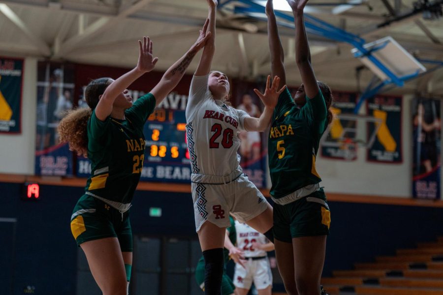 Forward Sheriene Arikat makes the tough layup between the Napa Valley defense against Napa Valley on Saturday, Feb. 25 in Santa Rosa.
