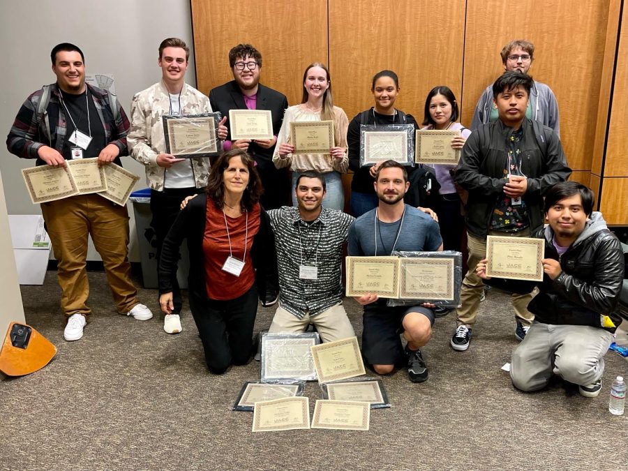 Members of The Oak Leaf pose with some of the 29 awards they won at the Fall 2022 Journalism Association of Community Colleges NorCal conference Oct 22 at Las Positas College.