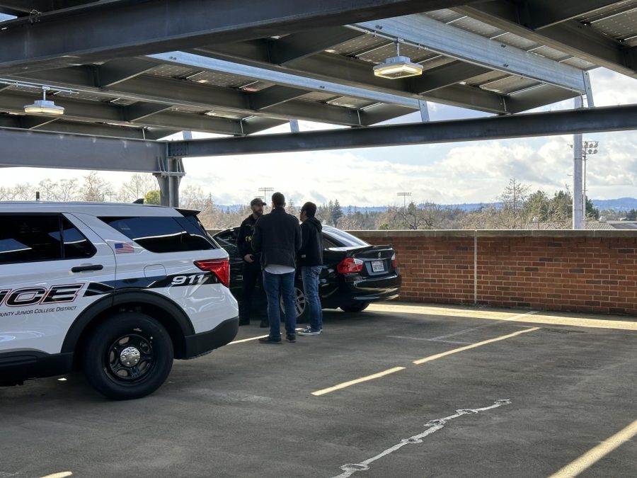 SRJC Police speak with members of the Sonoma County Department of Behavioral Health about a individual on top of the south side rooftop of the Zumwalt Parking Garage who appears to be in a mental crisis on Tuesday, Feb. 14, 2023 in Santa Rosa.
