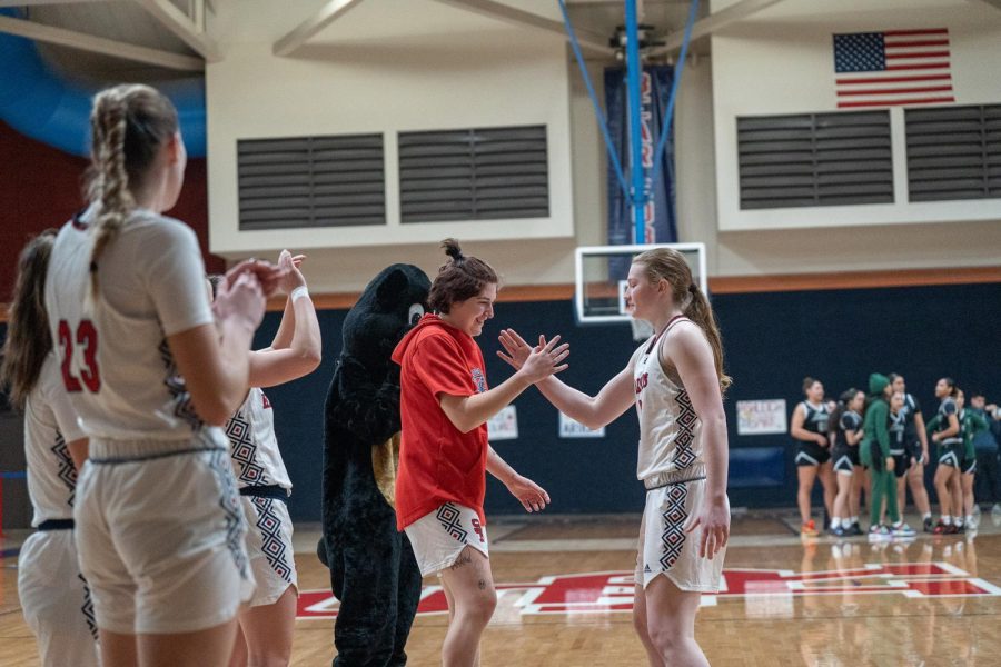 Guards Lucca Lowenburg and Alex Ditizio perform a handshake ritual prior to the game against Laney College Saturday, March 4. 