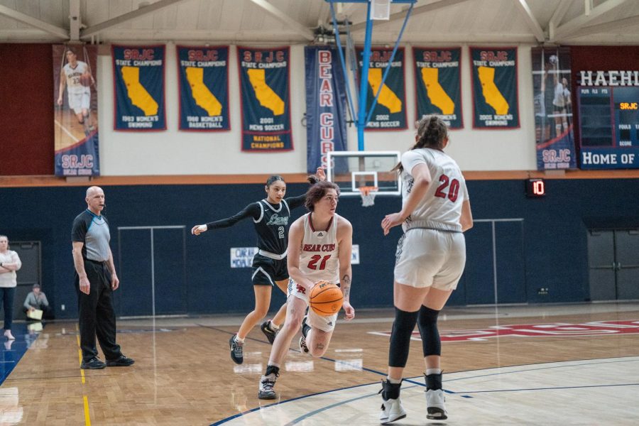 Guard Alex Ditizio dribbles the ball through the Eagles' defense during the first quarter of the game against Laney College Saturday, March 4 in Santa Rosa. 