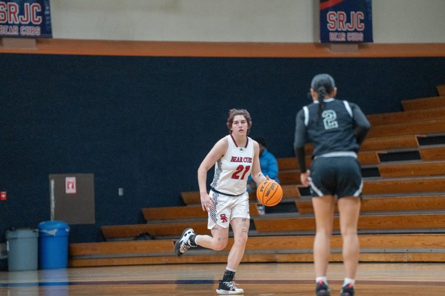 Guard Alex Ditizio dribbles the ball up the basketball court during the first quarter of the game against Laney College Saturday, March 4 in Santa Rosa. 