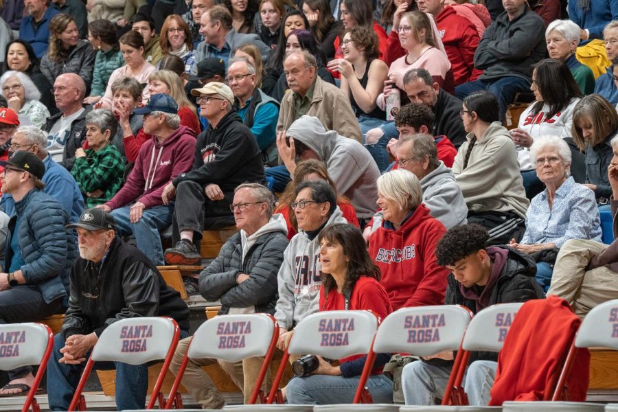 SRJC President Dr. Frank Chong eagerly spectates the SRJC Women's Basketball team in their game against Laney College Saturday, March 4 in Santa Rosa. 