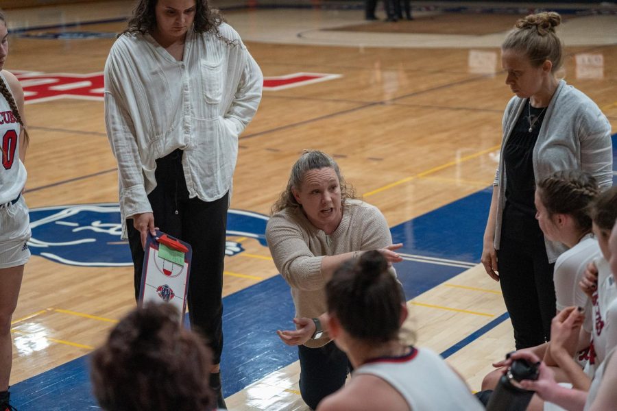 Coaches Lacey Campbell, Leslie Hirshfield and Emily Codding speak to the SRJC Womens Basketball team during a fourth quarter timeout in the game against Laney College Saturday March 4 in Santa Rosa. 