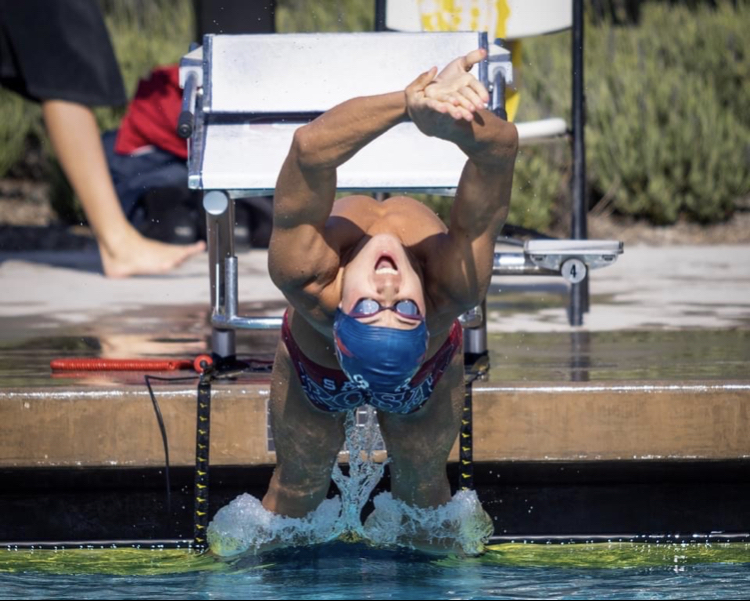 Andrew Morris jumping off the starting block in the 100 Back. 