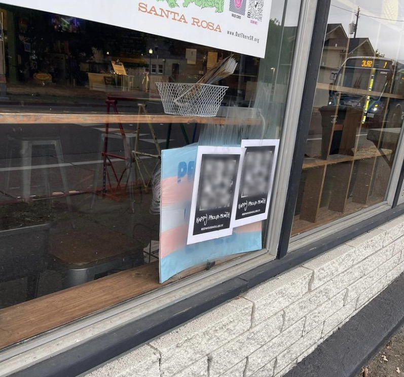 Members of the far-right Proud Boys organization covered a trans pride flag in the window of the Brew Coffee and Beer House in Santa Rosa with pamphlets displaying a QR code, which linked to a straight pride video, and the caption “Happy Proud Month.”
