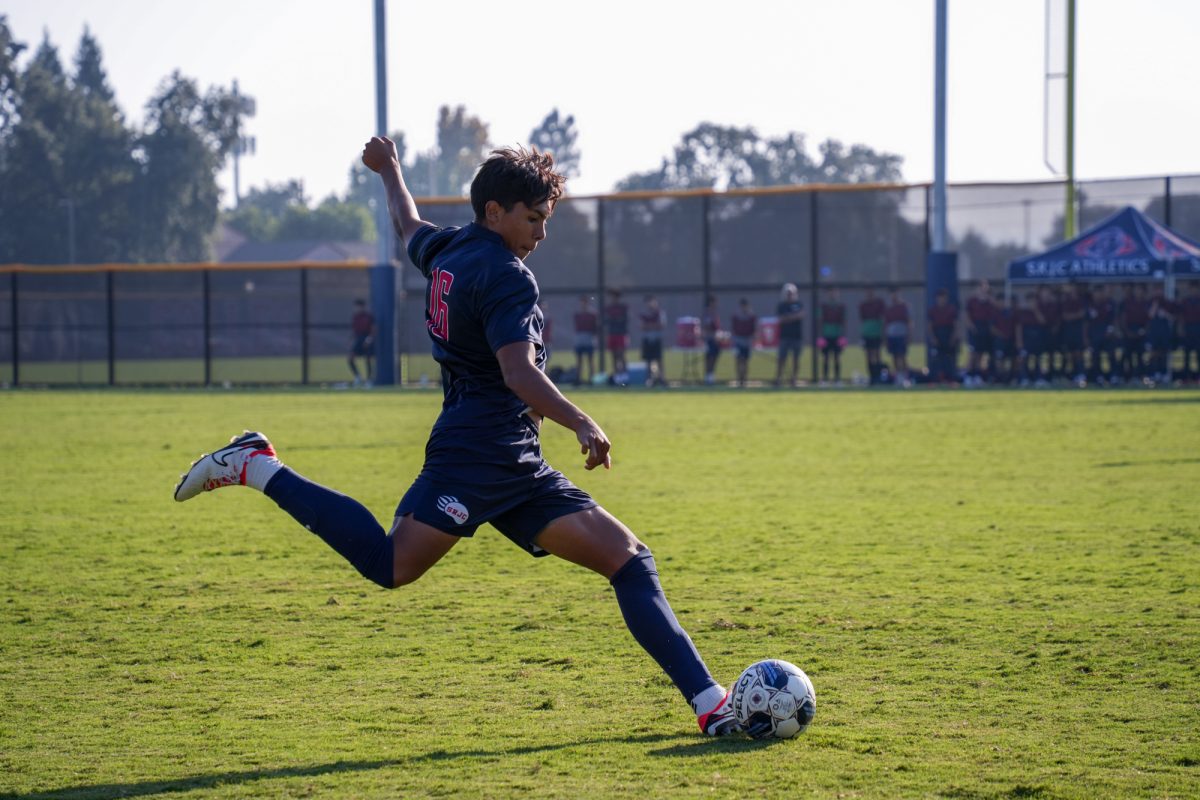 Bear Cubs defender Manuel Albor boots it long on a free kick.