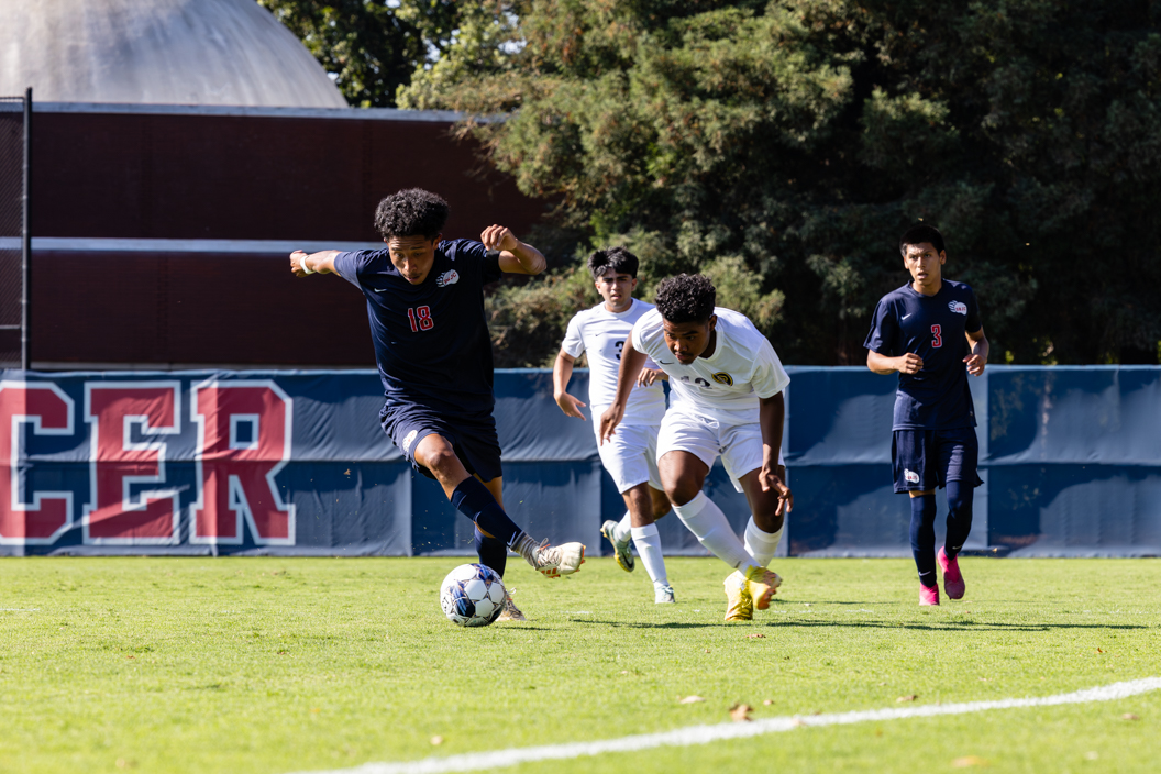 SRJC Defender Christopher Prudente keeps the ball away from Chabot Colleges offense helping SRJCs 5-1 runaway victory. 