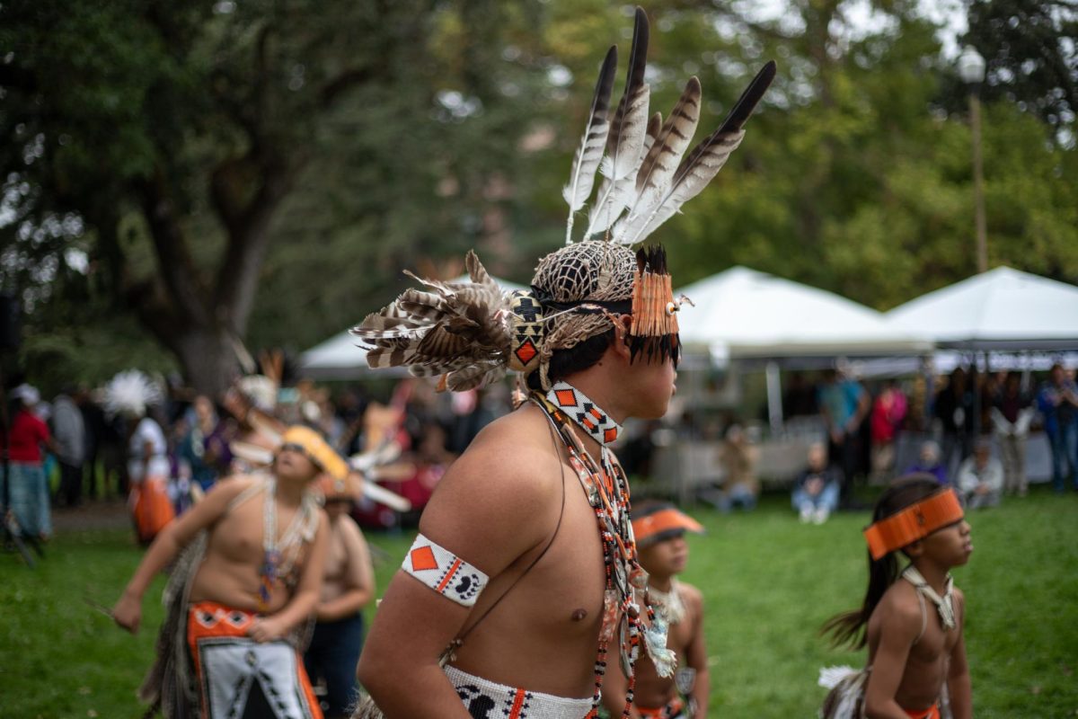 Sonoma County Youth Pomo Dancers form a large circle at SRJC Indigenous Peoples' Day on Monday, Oct. 9, 2023 in Santa Rosa. 